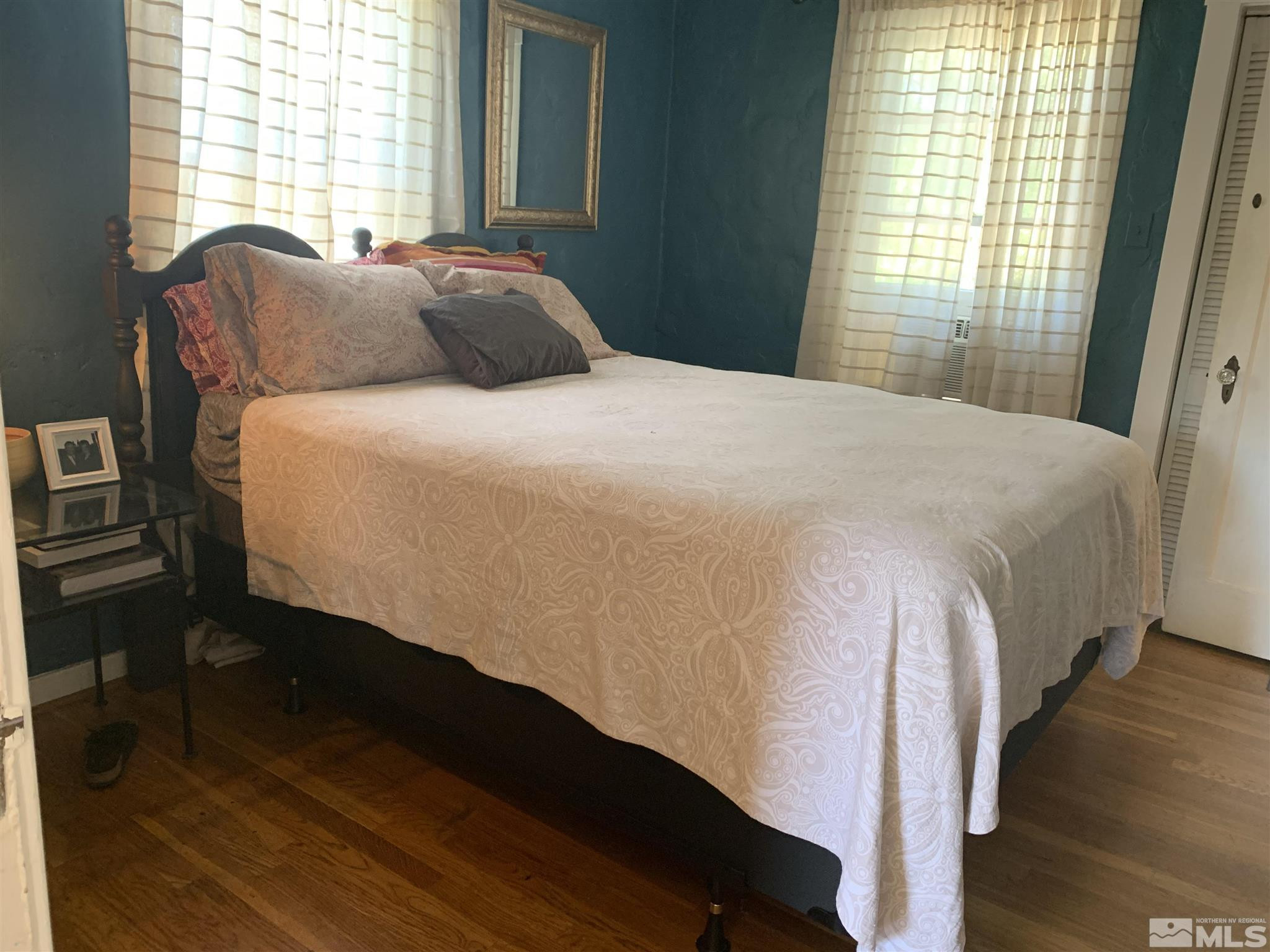 1230 Watt Street Reno, NV 89509 - Photo 10 of 18 a bedroom with a bed and wooden floor