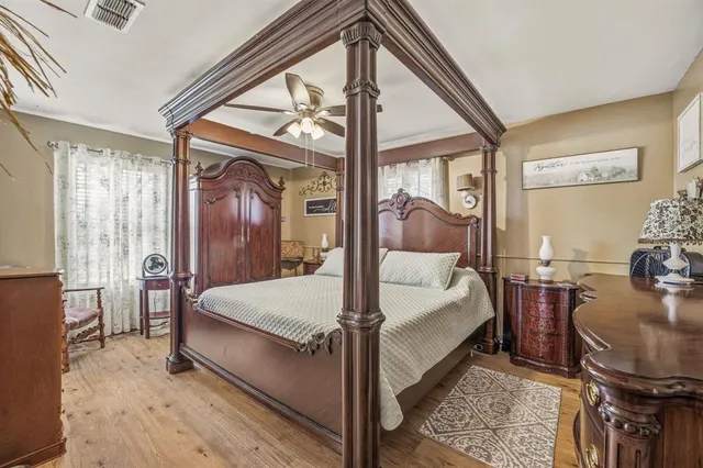 a bed room with a bed and glass door