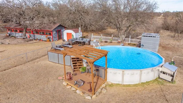 a view of a swimming pool with a patio
