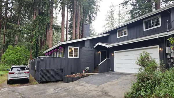 a front view of a house with parking space