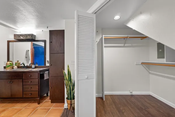 a kitchen with stainless steel appliances granite countertop a refrigerator and a stove