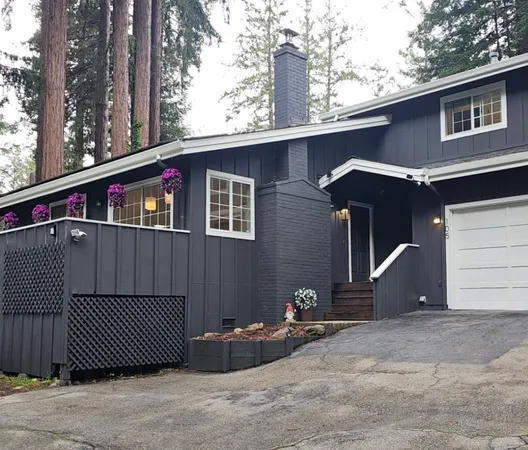 a view of a parking space in front of a house