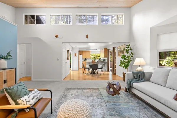 a living room with furniture and a table
