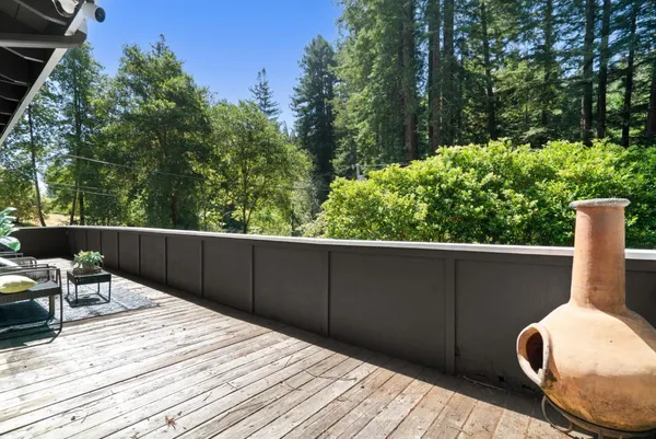 a balcony with wooden floor