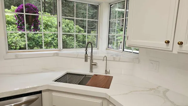 a bathroom with a window and tub