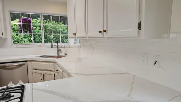 a kitchen with a sink and cabinets