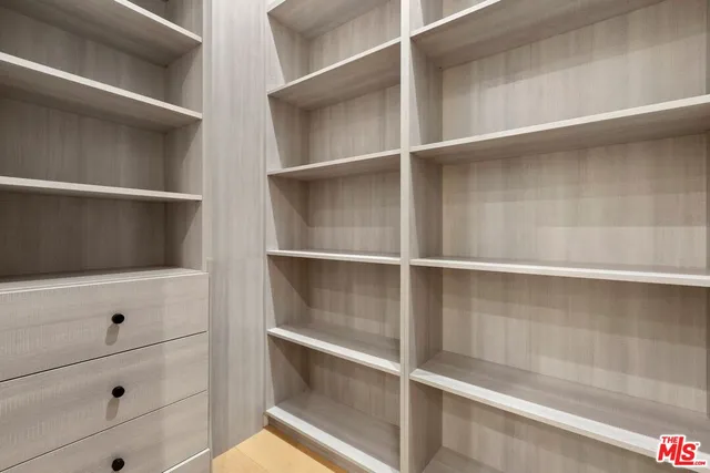 a view of a pool with a table and chairs