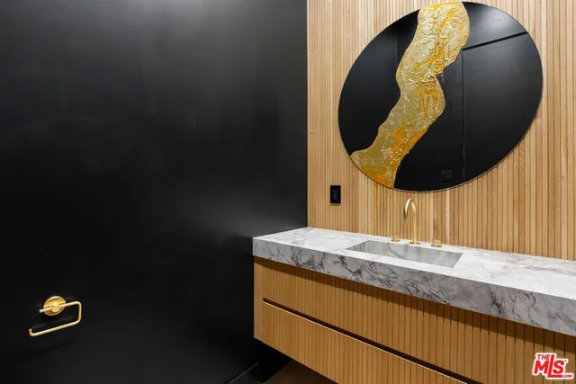 a living room with a couch a flat screen tv and a fireplace