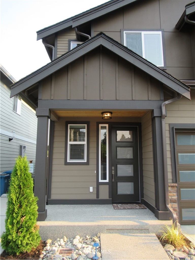8609 244th Street Southwest, Unit 6 Edmonds, WA 98026 - Photo 2 of 27 a front view of a house