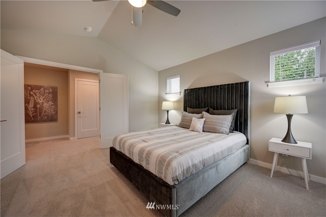 8609 244th Street Southwest, Unit 6 Edmonds, WA 98026 - Photo 10 of 27 a bedroom with a bed and a lamp