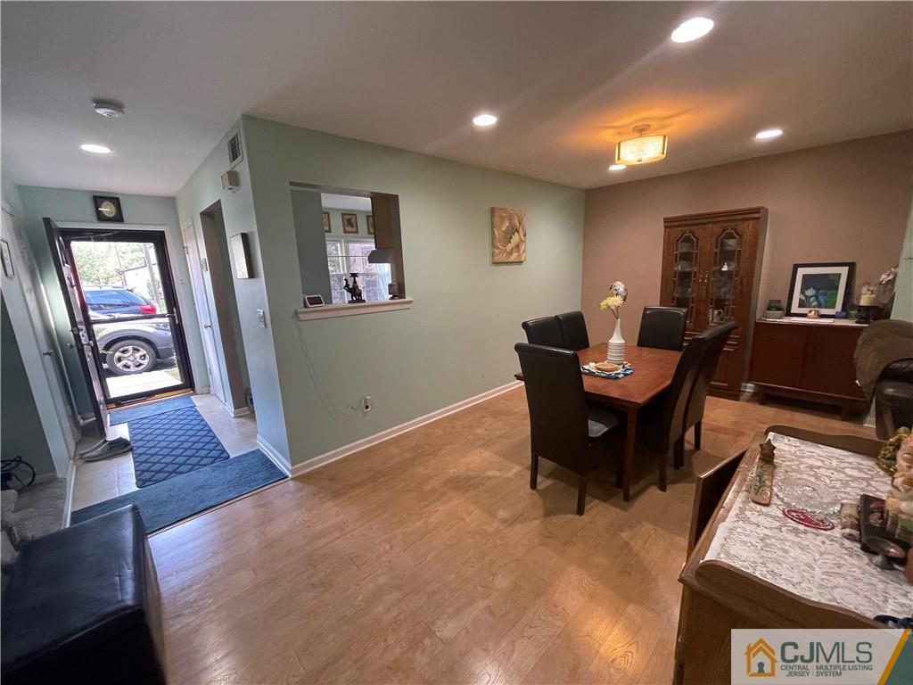 7503 Hana Road Edison, NJ 08817 - Photo 1 of 31 a living room with furniture and a wooden floor