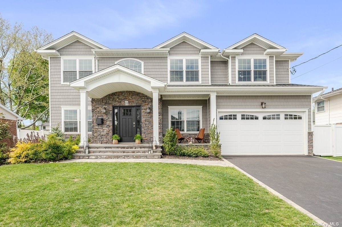 31 Pine Street Plainview, NY 11803 - Photo 1 of 1 a front view of a house with garden