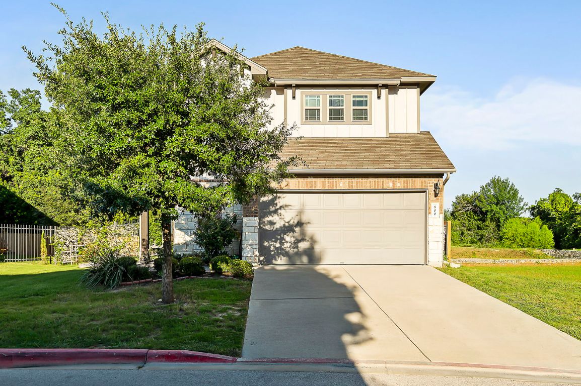 800 Totis Road Austin, TX 78748 - Photo 2 of 29 View of front facade featuring roof with shingles, board and batten siding, driveway, and an attached garage