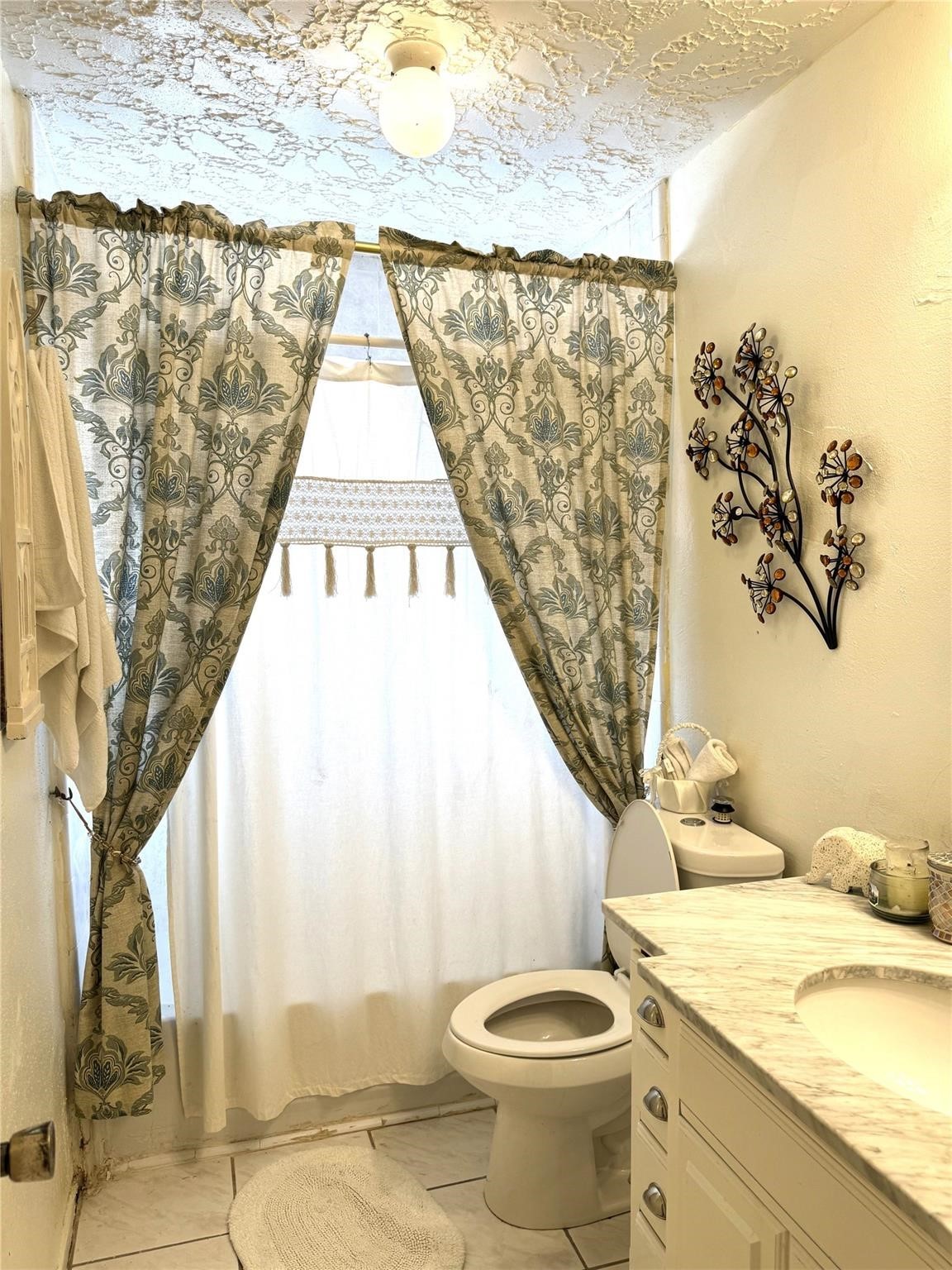 8403 Swan Meadow Lane Humble, TX 77338 - Photo 11 of 13 a bathroom with a granite countertop sink and a toilet