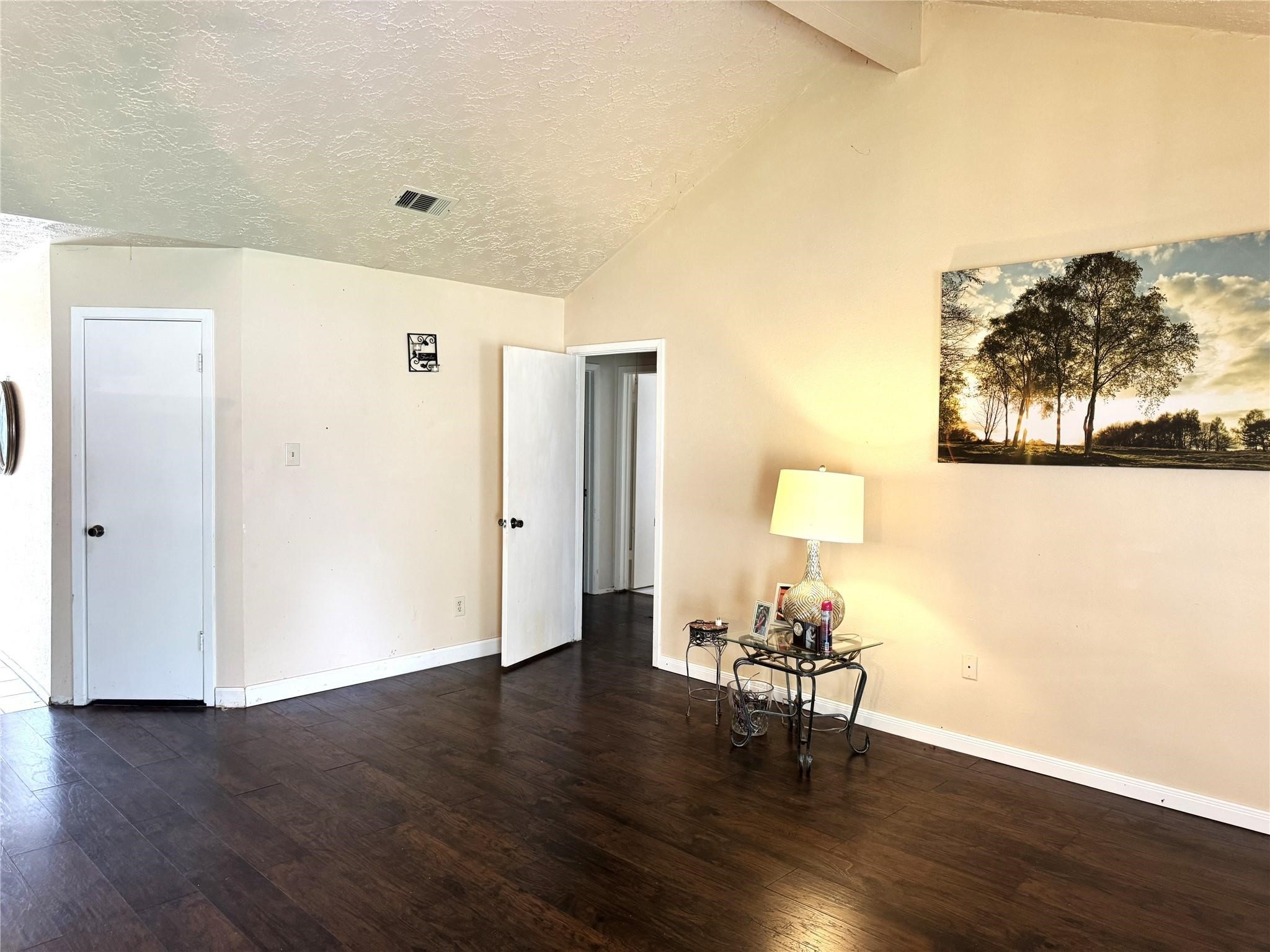 8403 Swan Meadow Lane Humble, TX 77338 - Photo 2 of 13 a view of a room with wooden floor a table and a chair