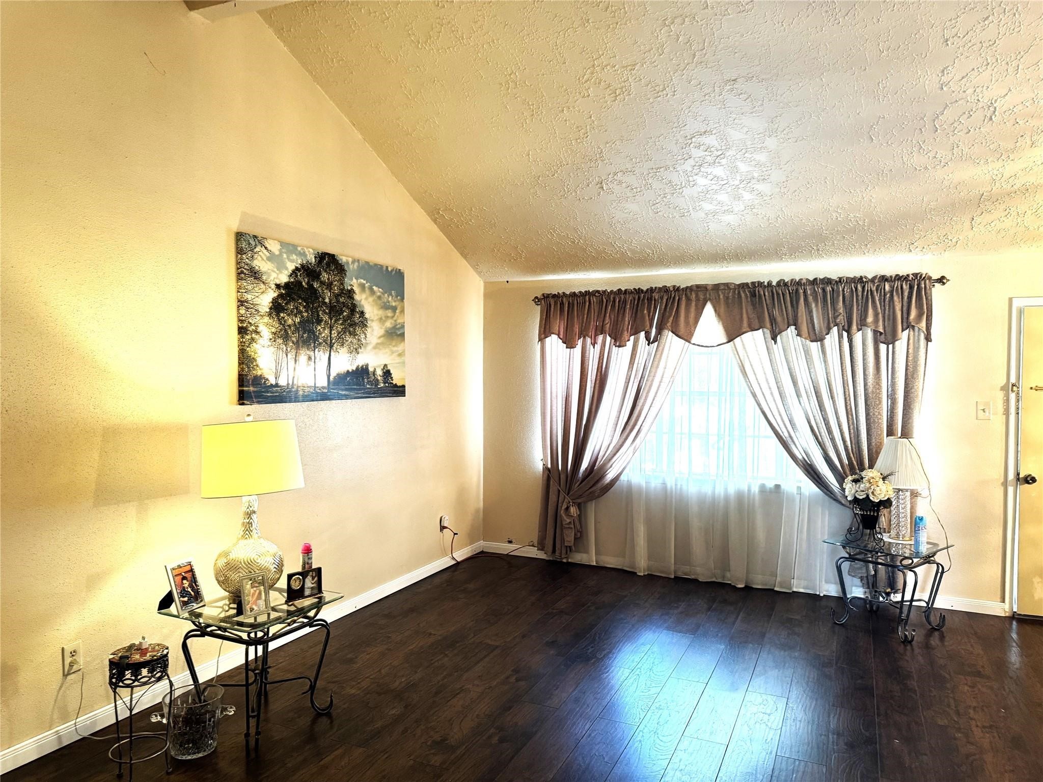 8403 Swan Meadow Lane Humble, TX 77338 - Photo 3 of 13 wooden floor in an empty room with a window