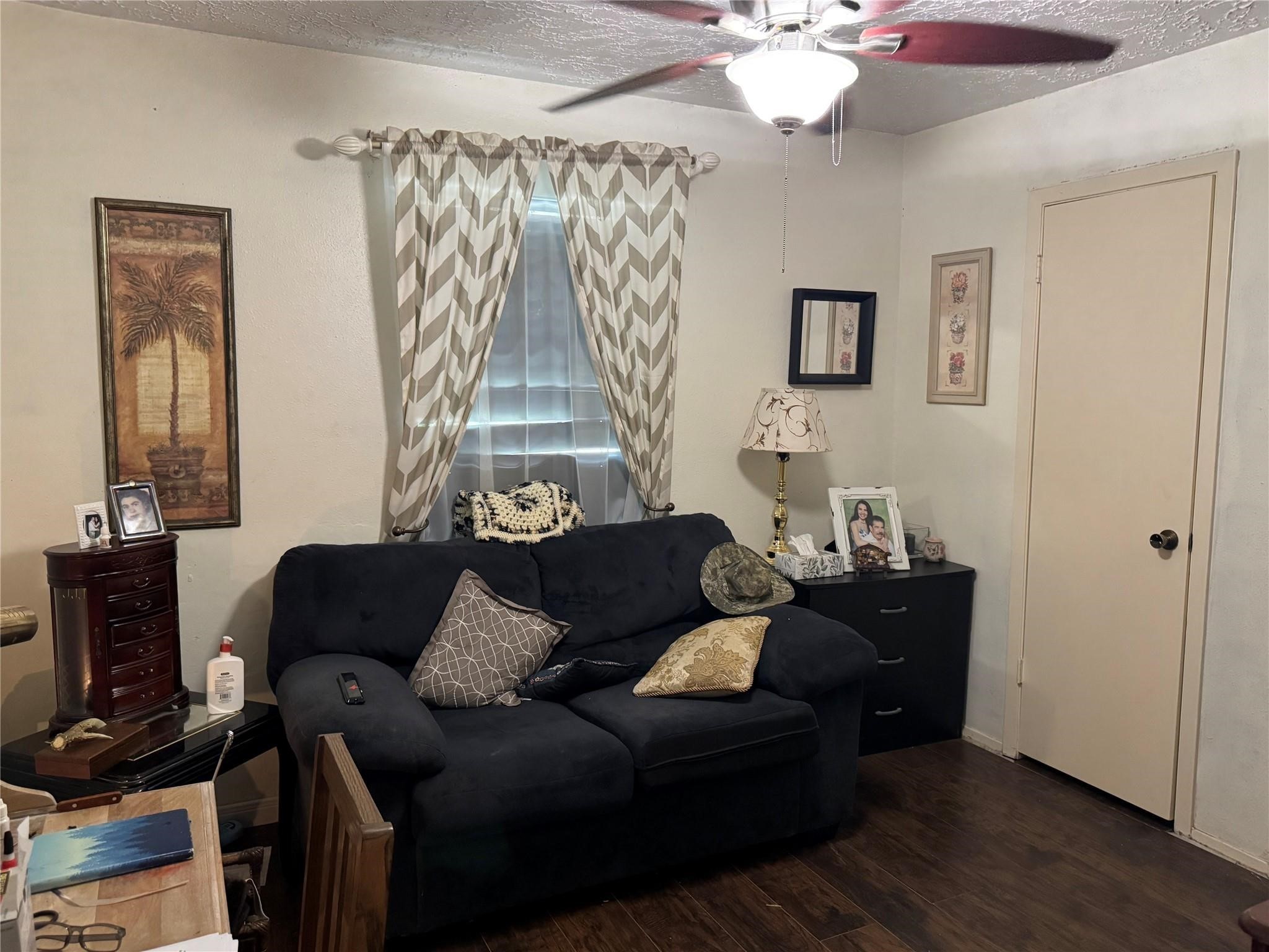 8403 Swan Meadow Lane Humble, TX 77338 - Photo 10 of 13 a living room with furniture and a wooden floor