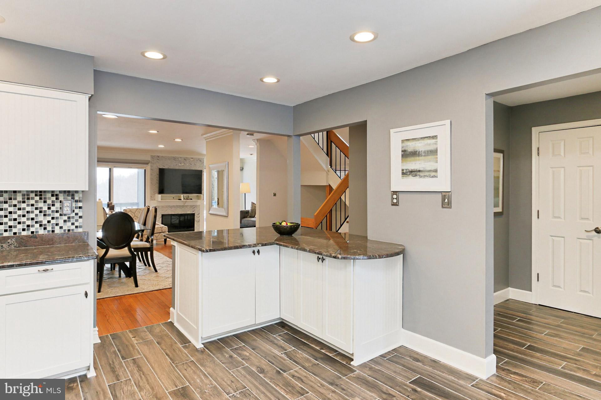 2071 Wethersfield Court Reston, VA 20191 - Photo 4 of 34 Bright white cabinets w/ pristine granite counters