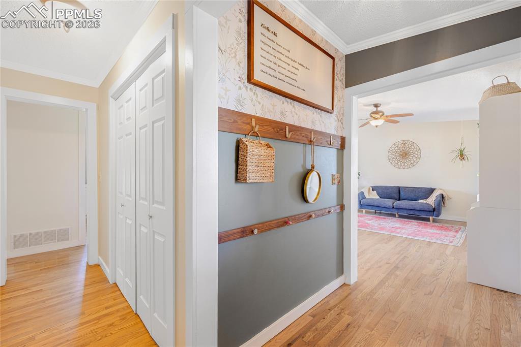17520 Fremont Fort Road Peyton, CO 80831 - Photo 14 of 42 The property features a foyer with hardwood flooring and feature wall