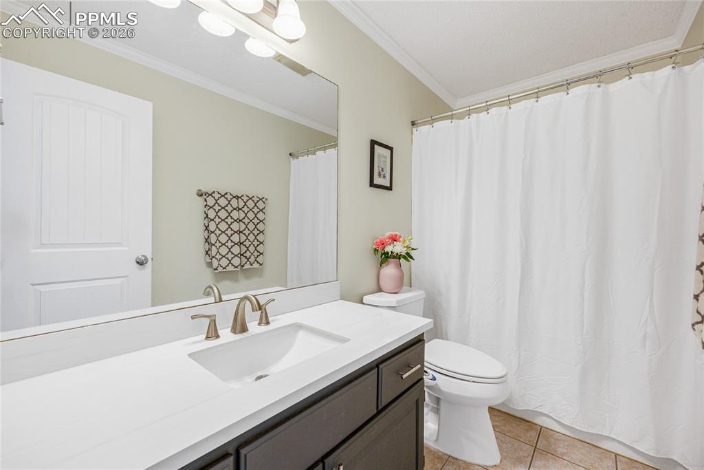 17520 Fremont Fort Road Peyton, CO 80831 - Photo 16 of 42 Bathroom featuring a vanity with a white marble countertop