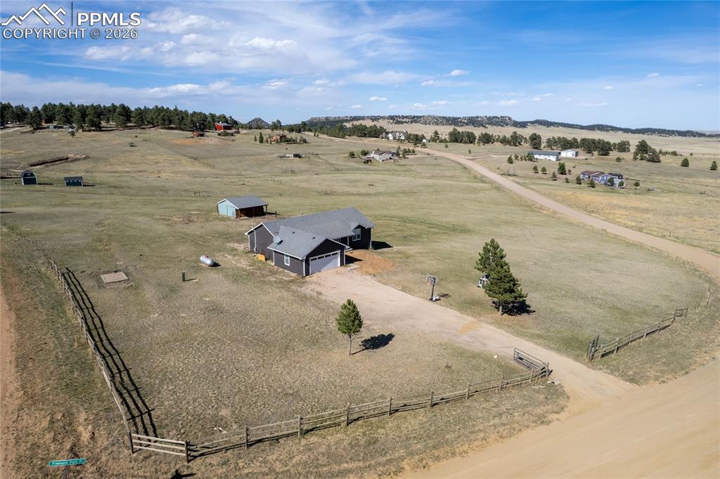 17520 Fremont Fort Road Peyton, CO 80831 - Photo 3 of 42 This property features a single-story residence with an attached garage, a separate barn outbuilding, and a fenced perimeter