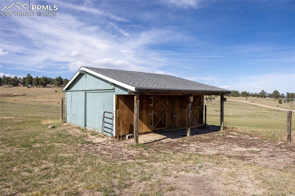 17520 Fremont Fort Road Peyton, CO 80831 - Photo 35 of 42 The property features a barn with water and electric