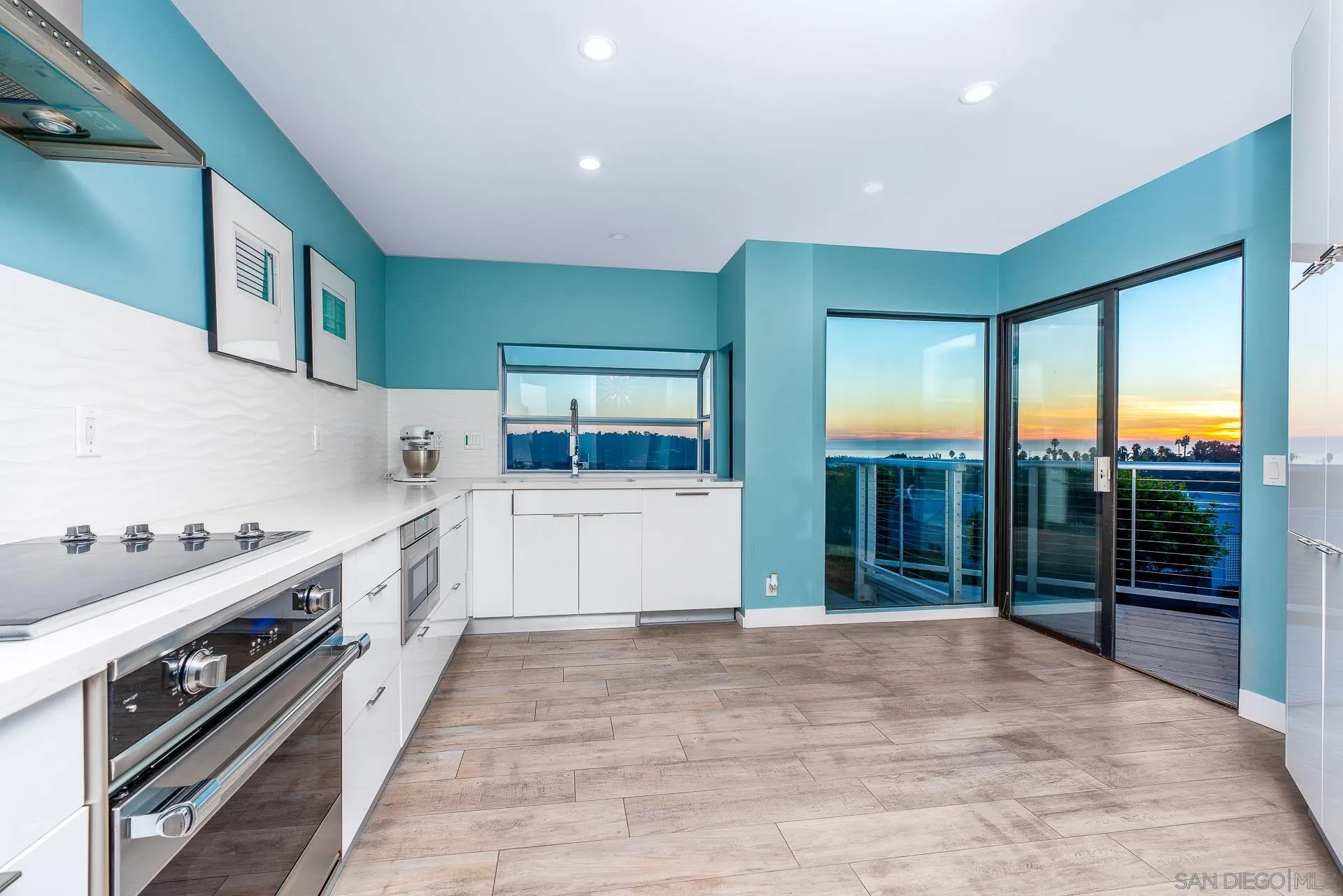 1060 America Way Del Mar, CA 92014 - Photo 11 of 61 a large white kitchen with a large window