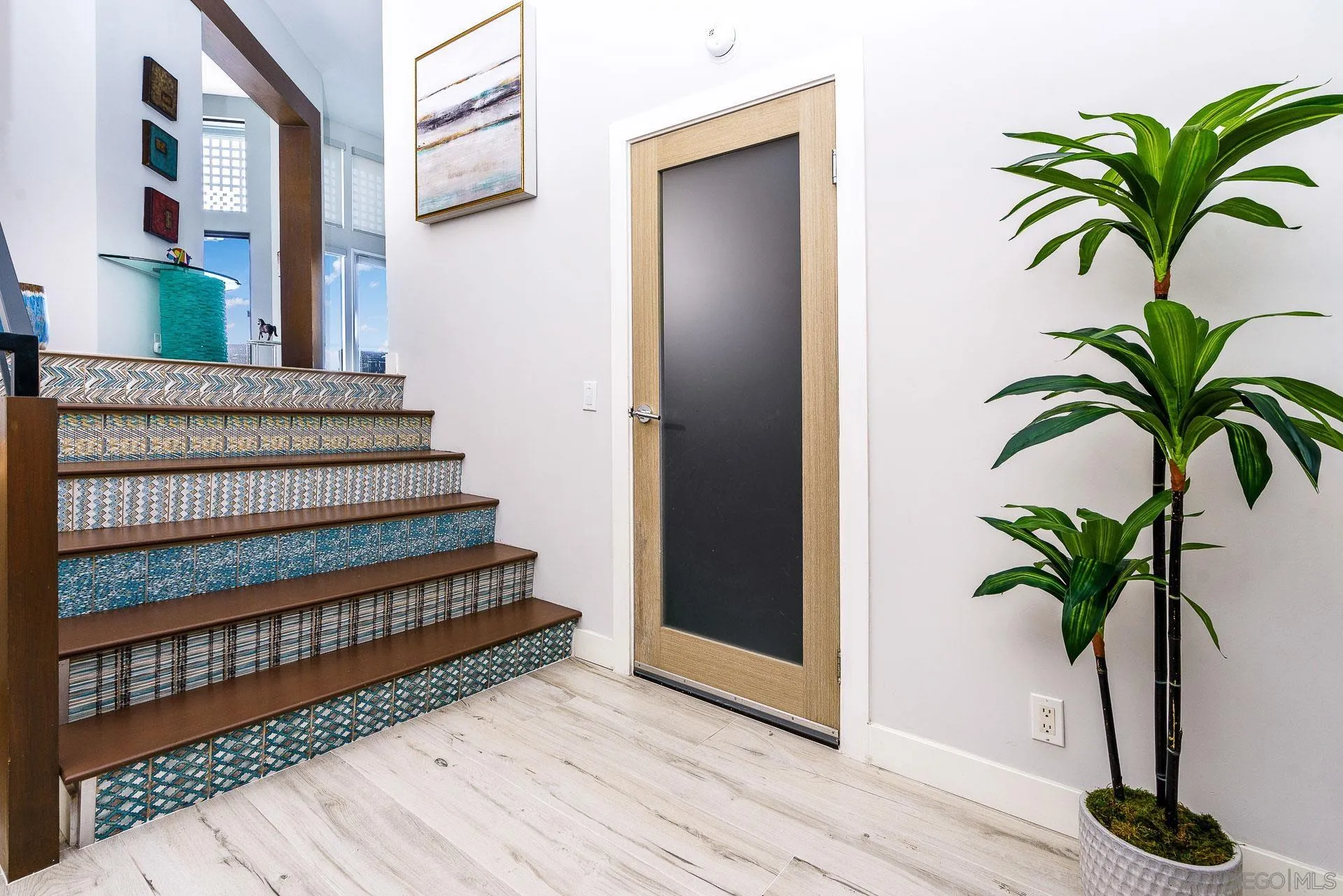 1060 America Way Del Mar, CA 92014 - Photo 15 of 61 a view of entryway with wooden floor and a potted plant