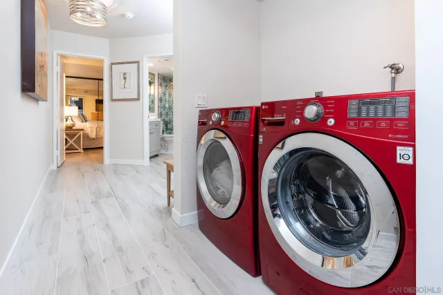 a spacious bedroom with a bed and a flat screen tv