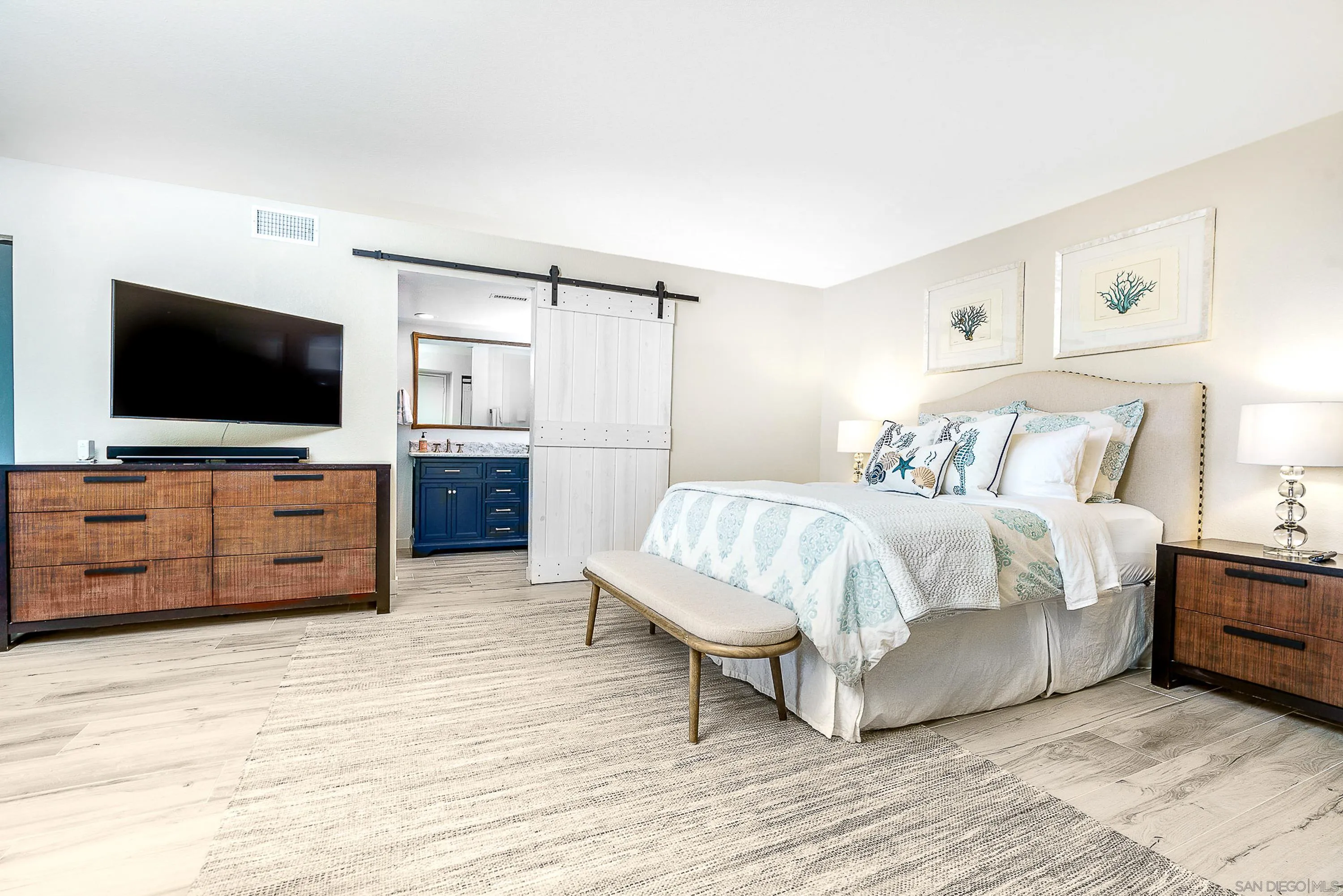 1060 America Way Del Mar, CA 92014 - Photo 19 of 61 a spacious bedroom with a bed and a flat screen tv