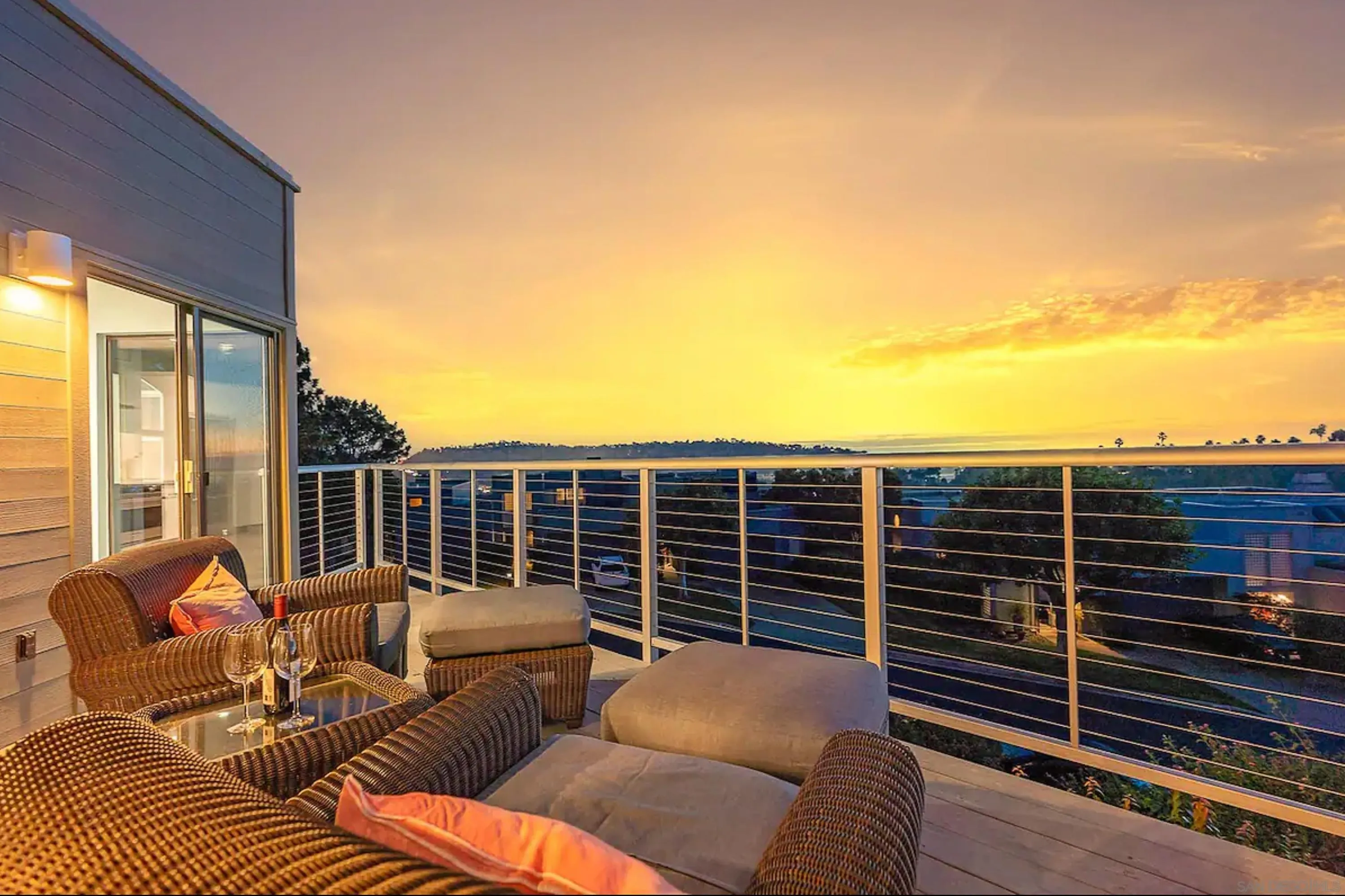 1060 America Way Del Mar, CA 92014 - Photo 2 of 61 a balcony with furniture and a floor to ceiling window