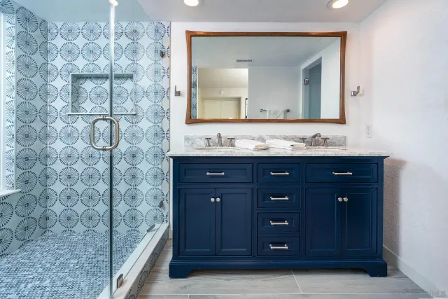 a bedroom with a bed and a night stand