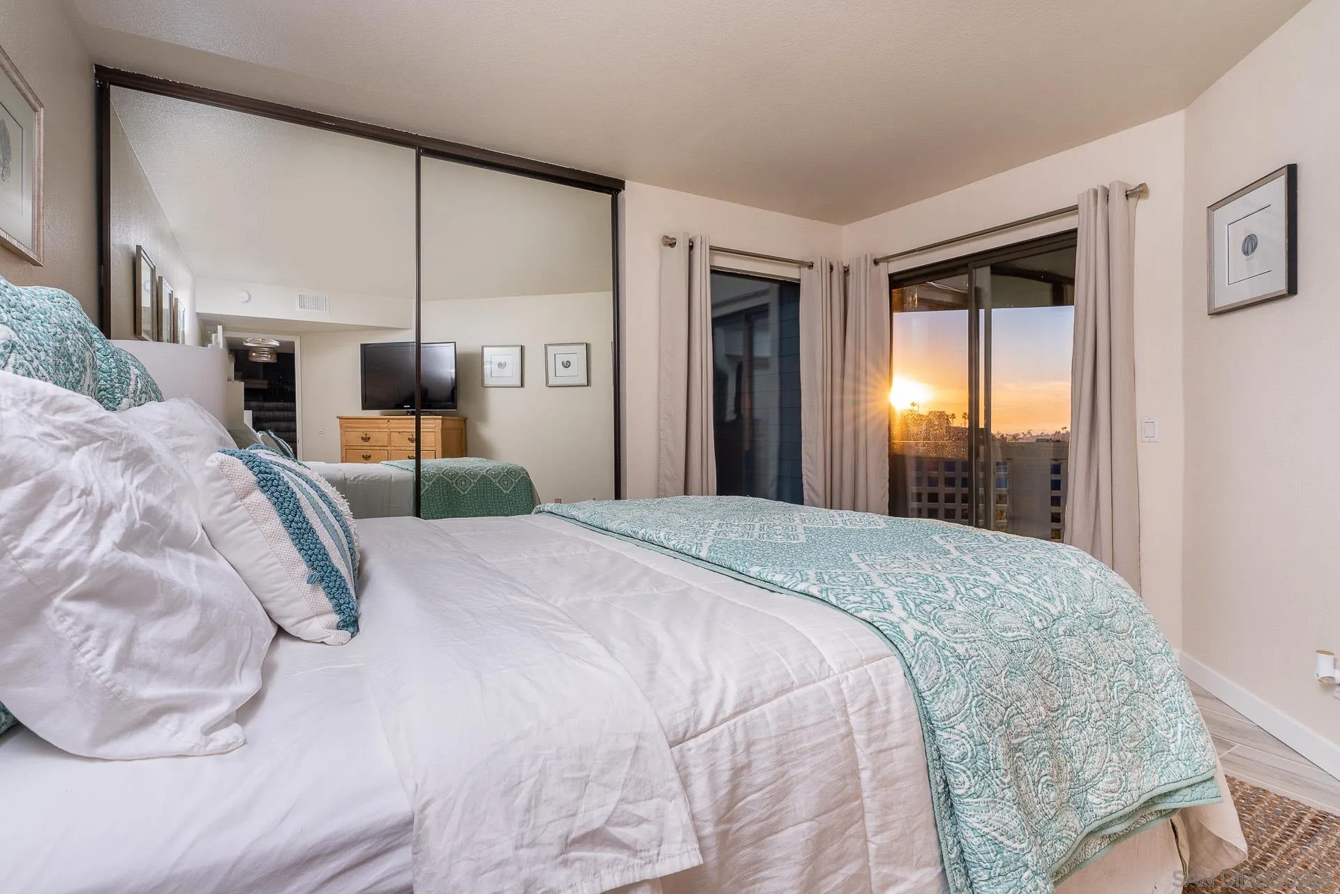 1060 America Way Del Mar, CA 92014 - Photo 25 of 61 a bedroom with a large bed and a large window