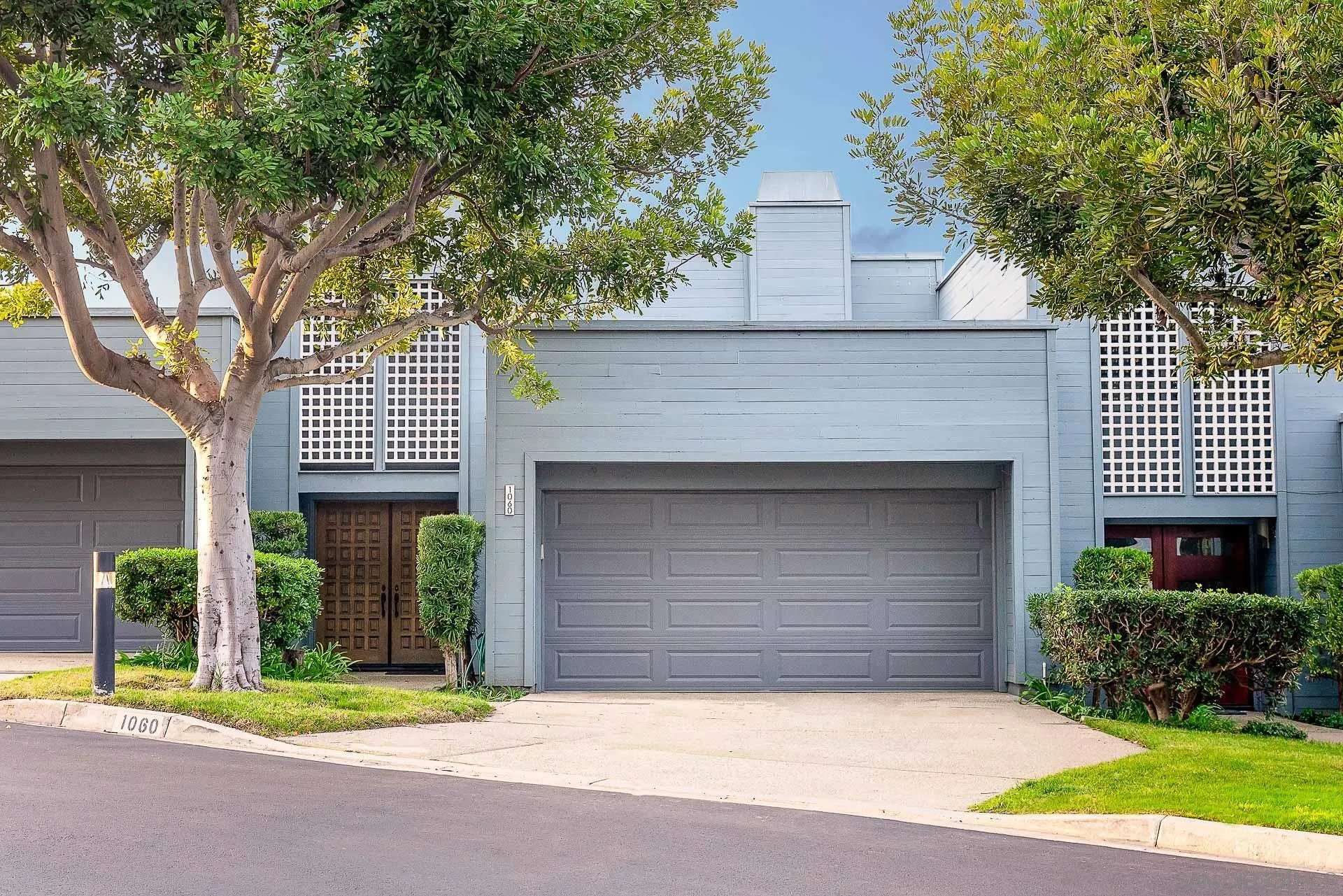 1060 America Way Del Mar, CA 92014 - Photo 28 of 61 a front view of a house with a yard and garage