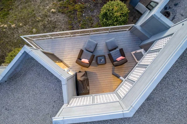 an aerial view of residential houses with outdoor space