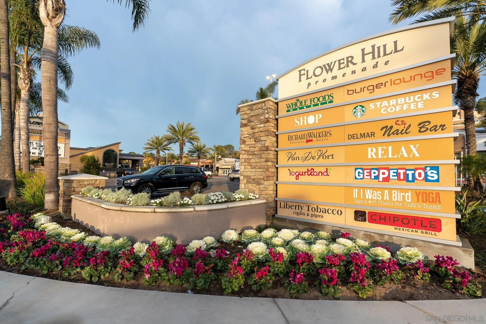 1060 America Way Del Mar, CA 92014 - Photo 47 of 61 a front view of a building with flowers