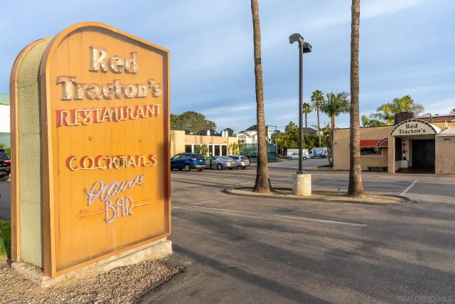 a view of a city street with cars