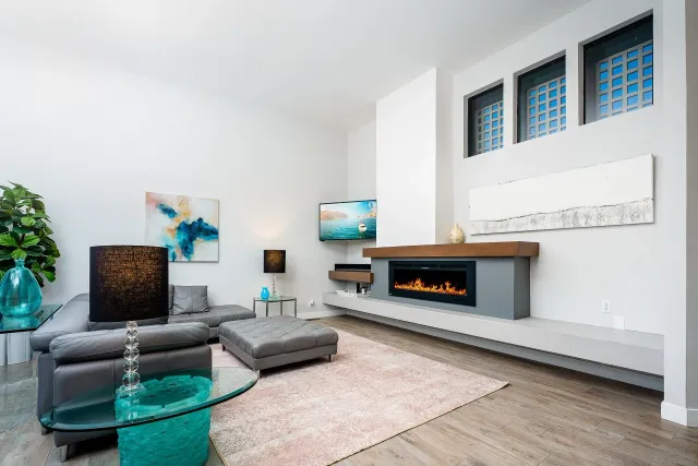 a living room with furniture and a fireplace