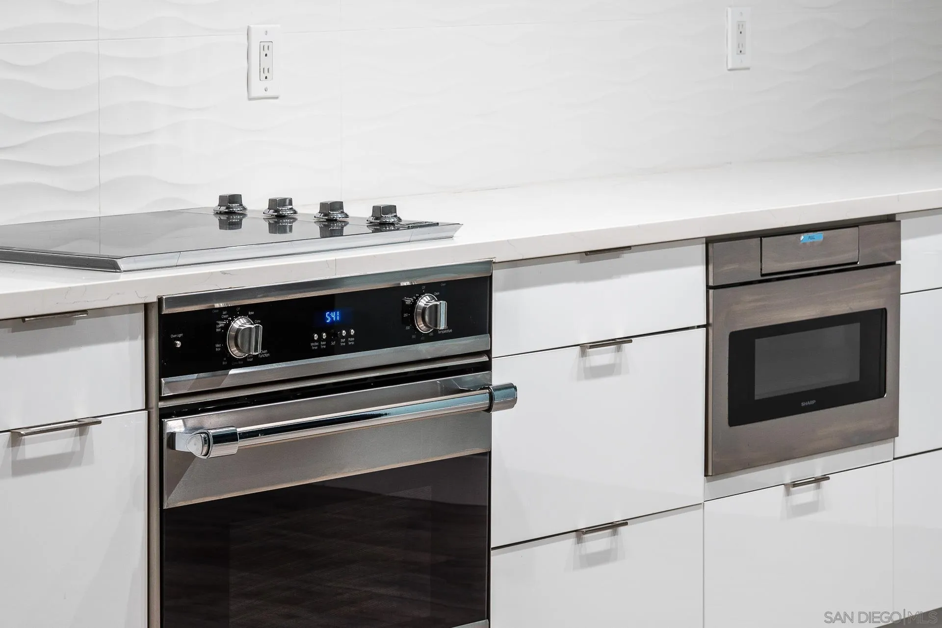 1060 America Way Del Mar, CA 92014 - Photo 10 of 61 a stove top oven sitting inside of a kitchen