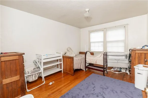 a bedroom with furniture and a window