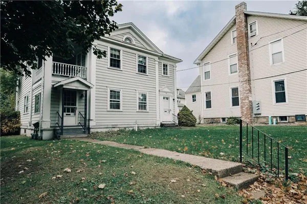 a front view of a house with a yard