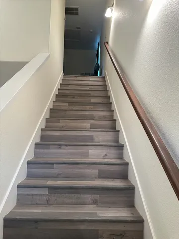 a bed room with furniture and window