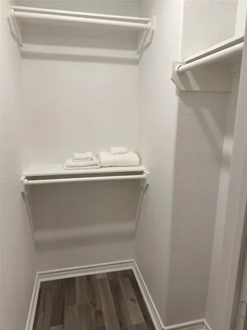 a bedroom with a bed and chair