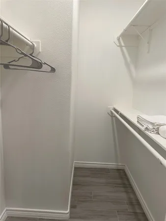 a view of a room with racks on the wall