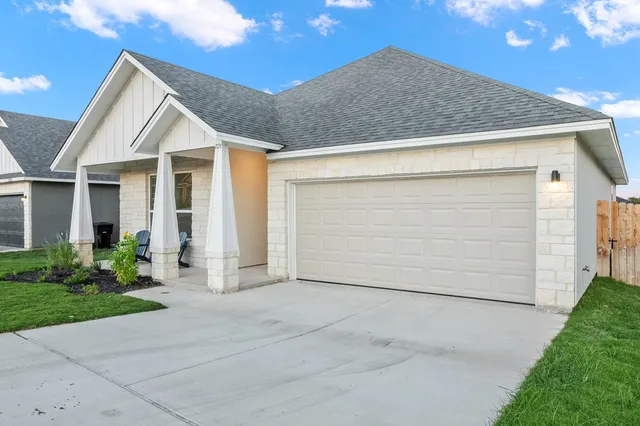 a view of house with garage