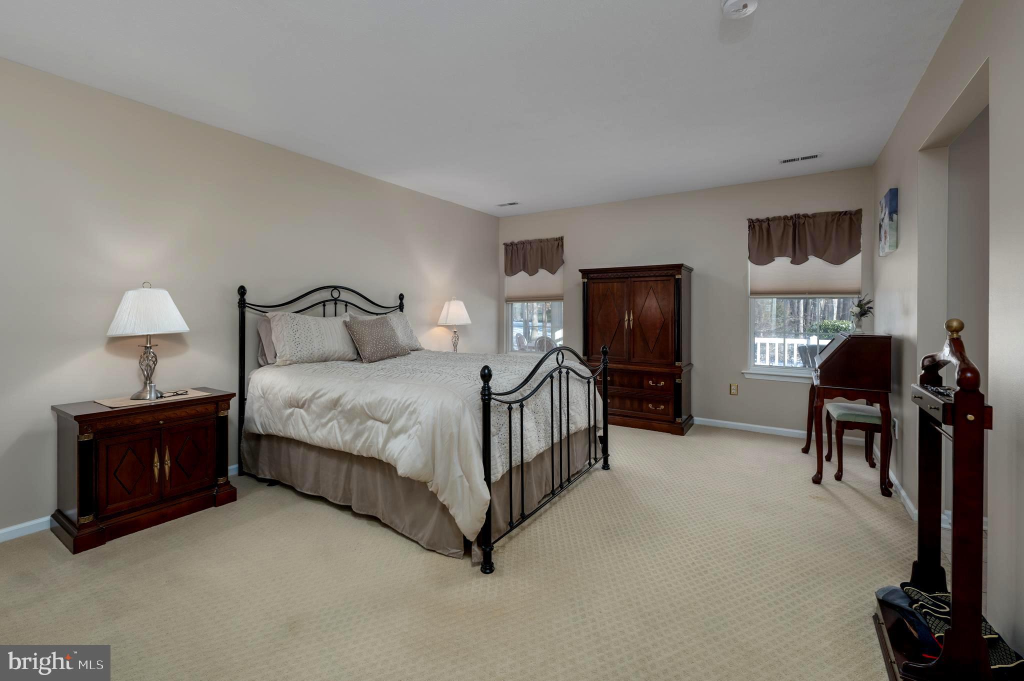 515 Hydrangea Drive Mount Laurel, NJ 08054 - Photo 15 of 36 a bedroom with a bed and dresser with chair