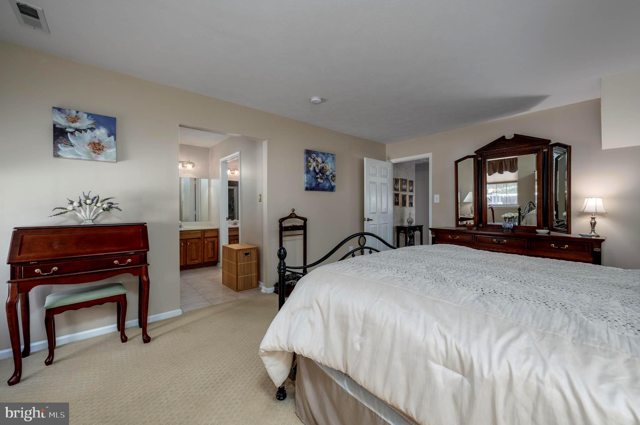 515 Hydrangea Drive Mount Laurel, NJ 08054 - Photo 17 of 36 a bed room with a bed and a television