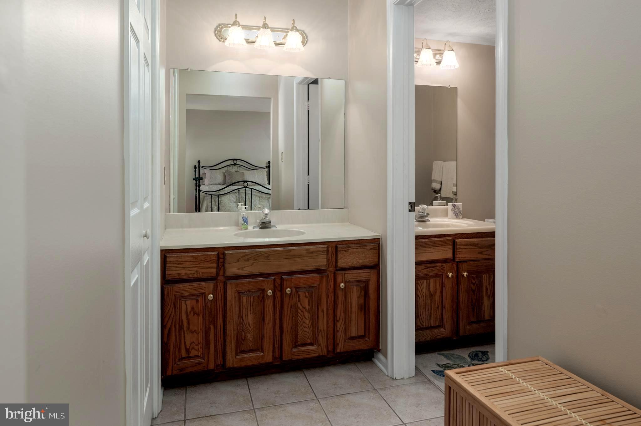 515 Hydrangea Drive Mount Laurel, NJ 08054 - Photo 18 of 36 a bathroom with a sink and a mirror