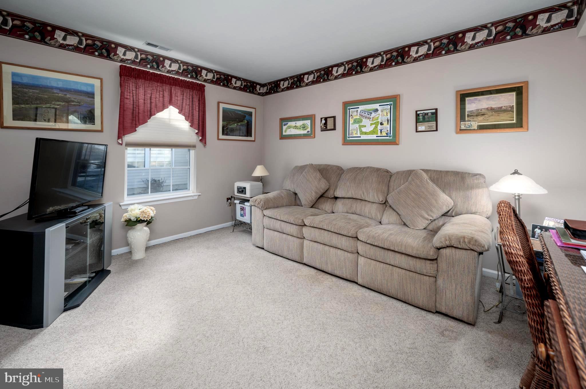 515 Hydrangea Drive Mount Laurel, NJ 08054 - Photo 20 of 36 a living room with furniture and a flat screen tv