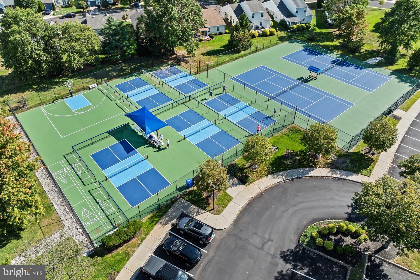 515 Hydrangea Drive Mount Laurel, NJ 08054 - Photo 33 of 36 an aerial view of a tennis ground and a cars park side of the road